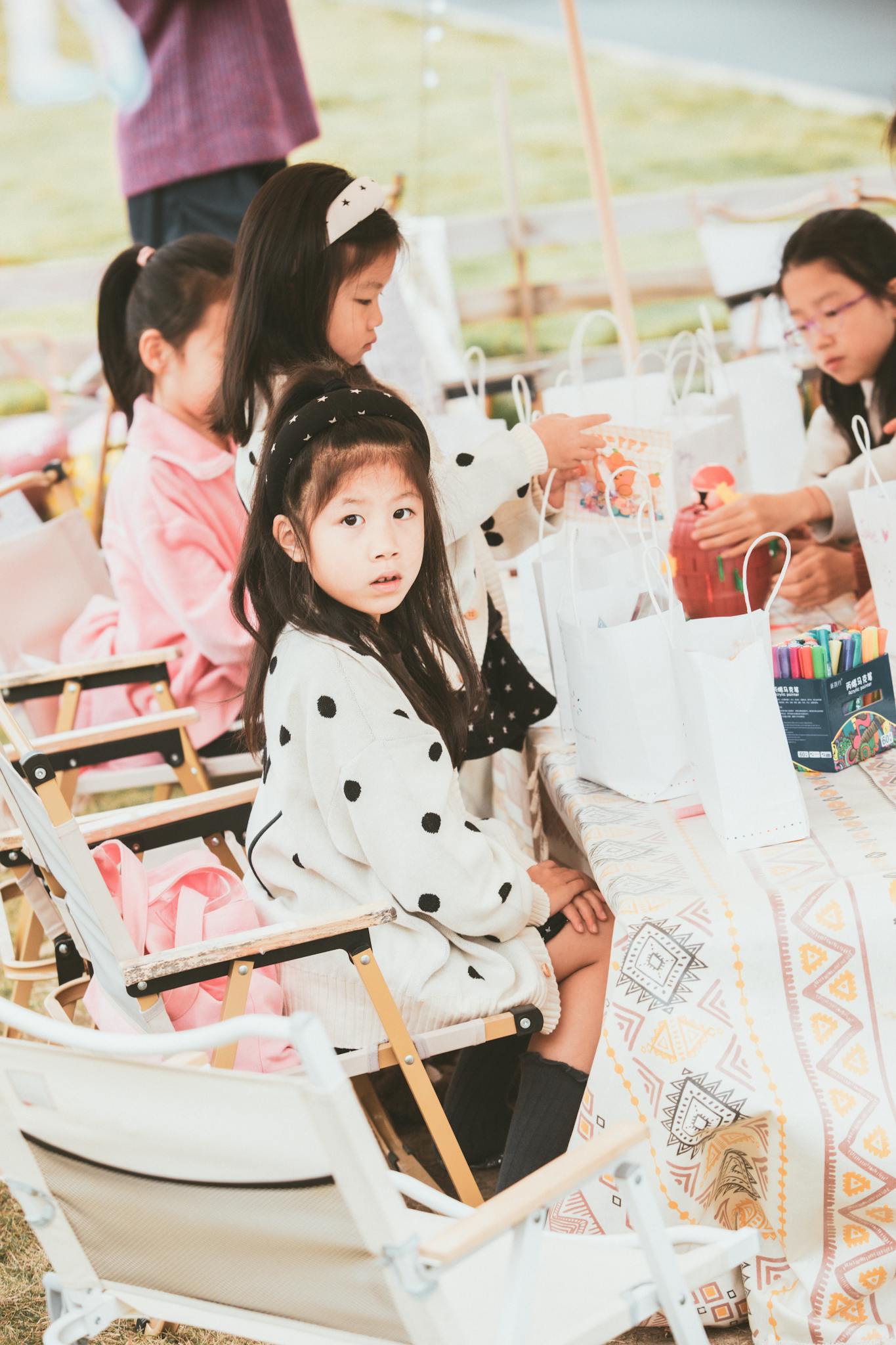 Adorable children enjoying a creative outdoor activity together.